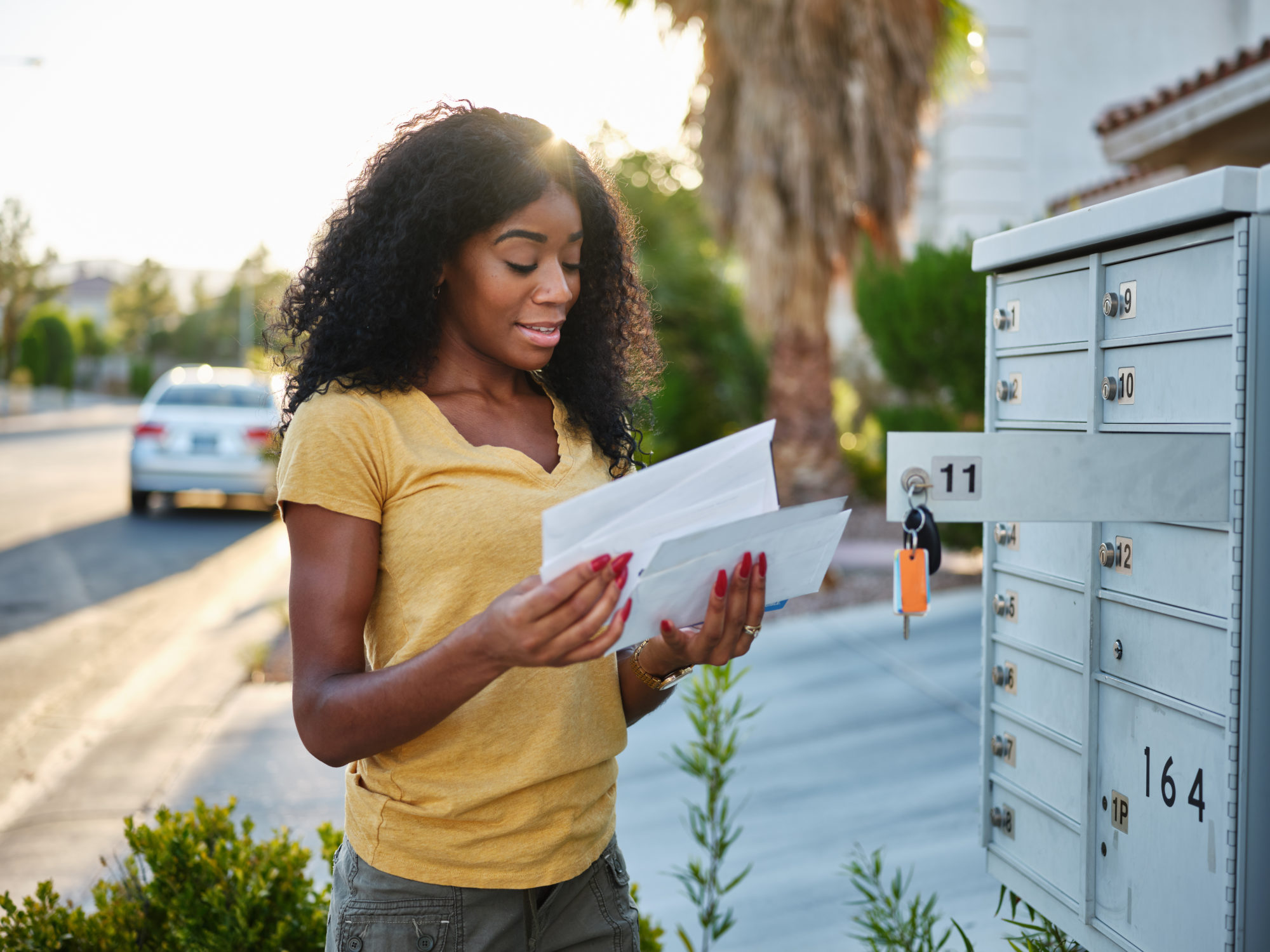 woman checking direct mail nonprofit fundraising